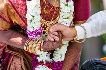Fototapeta na wymiar South Indian Tamil couple's holding hands close up