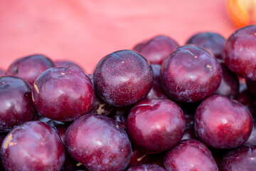  Group of fruit plums in the market.