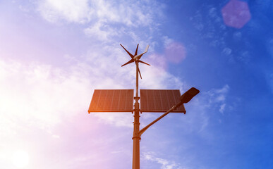 Renewable energy sources. Wind turbine with solar energy power panel, renewable photovoltaic technology. Alternative energy concept.