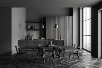 Grey kitchen interior with table and chairs, cooking and dining area, window