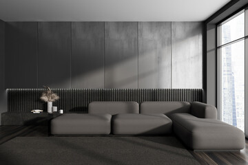 Grey chill room interior with sofa and decoration, panoramic window. Empty wall