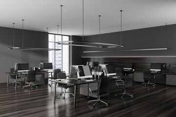 Grey office interior with pc computer, desk and panoramic window on city view