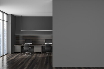 Grey office interior with pc computer and armchairs on wooden floor. Mockup wall