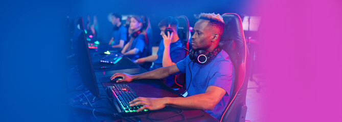 Banner Team professional gamer playing winning tournaments online games computer