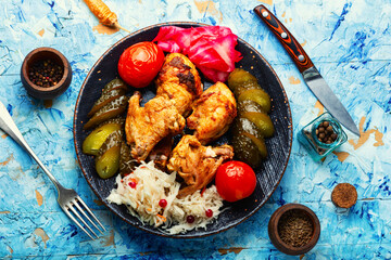 Roasted chicken meat and pickles.