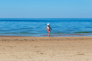 child walking on the beach