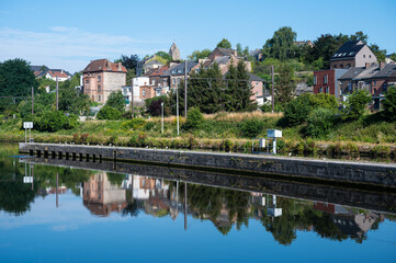 Namur, Wallon Region, Belgium,  Worker houses reflecting in the banks of the River Sambre