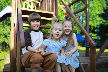 Children walk in the summer in nature. Child on a sunny spring morning in the park. Traveling with children.