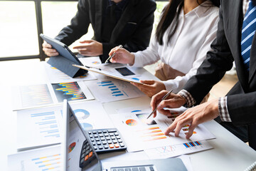 Meeting concept Business team hands at working with financial plan, meeting, discussion, brainstorm with tablet on the office desk