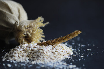 World grain crisis. A handful of cereals and on a dark background.