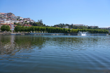 Fototapeta na wymiar Promenade in Coimbra city at Mondego river in Portugal