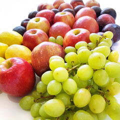 Ripe and juicy fruit. Plums, peaches, grapes, lemons, apples. Vegetarian healthy natural food and ingredients for eating raw as salad, smoothie or juice 