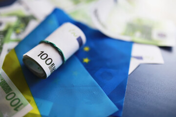 The concept of European Union support for Ukraine in a military conflict. Solidarity. Politics. Flags are on the table.