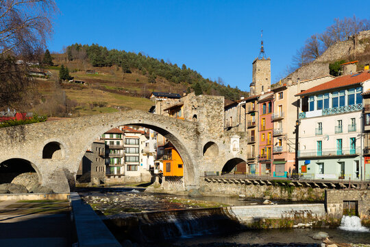 View of medieval Spain town of Camprodon with Ter river and ancient stone bridge Pont Nou