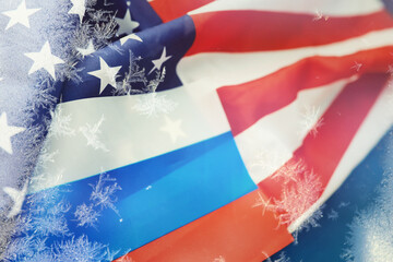 American and Russian flag. US sanctions against Russia. Aggravation and freezing of diplomatic relations. Cold War.