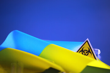 Ukrainian flag biohazard and test tubes. Assistance to Ukraine in biolaboratories. Western...