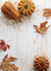Autumn background of leaves and pumpkins