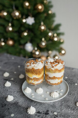 Pastries with caramel in transparent cups on the table
