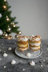 Pastries with caramel in transparent cups on the table