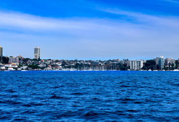 Sydney Harbour Australia at Sunset, lovely coloured skies boats ferries cruise liners houses and buildings 