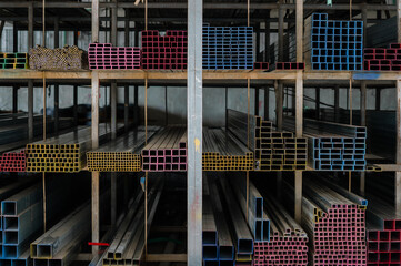 Metal pipes or steel in industry background.