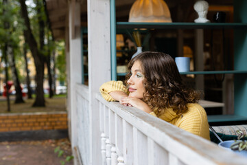 Girl in caffee outdoor. Lifestyle with seasonal disease.