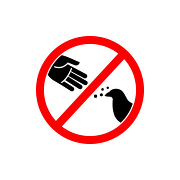 Do Not Feed Sign or Do Not Feed Symbol Vector On White Background. Do not feed the birds warning sign, stylized vector pigeon silhouette and hand symbol in crossed red circle.