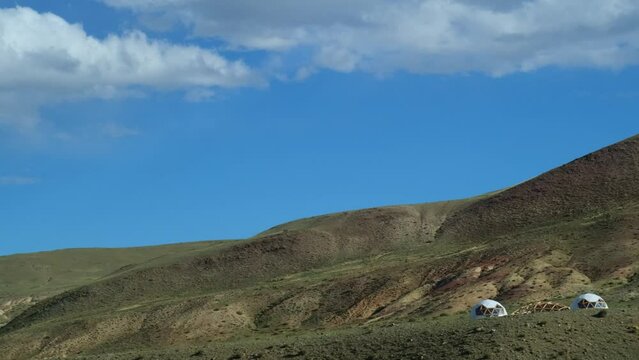 Domed residential buildings in the mountains. Round houses with a spherical roof for panoramic view of beautiful natural landscapes. Construction stage. Eco touristic glamping camps.