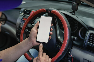 Mobile phones with white screen size driving the concept of a car to find directions with GPS.