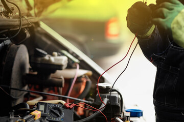 Fototapeta car electrical diagnostics with an electronic tester obraz