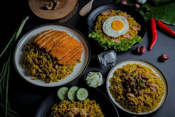 Close Up Traditional Fried Rice or Nasi Goreng Indonesian Food on Black Plate with Top View Isolated Background