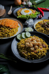 Close Up Traditional Fried Rice or Nasi Goreng Indonesian Food on Black Plate with Top View Isolated Background