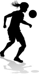 A female soccer football player woman in silhouettes