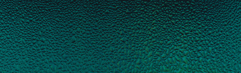 Abstract glass texture with natural water condensation. Design pattern toned in emerald color