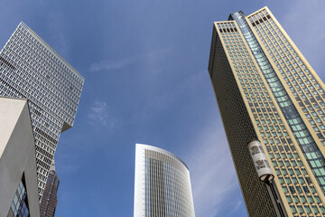 Fototapeta na wymiar Low angle shot of the Pollux, One and 185 towers in Frankfurt, Germany