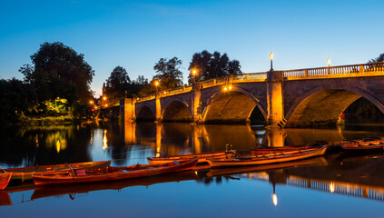 Fototapeta na wymiar The famous landmark, iconic and historical bridge in London, Richmond Upon Thames, illuminated in evening lights, in United Kingdom