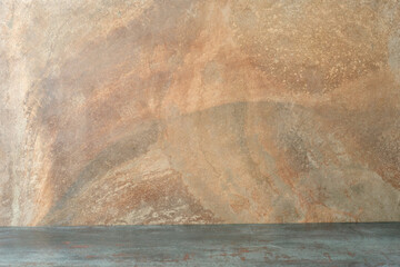 Grunge orange concrete wall and grunge green floor. Empty space