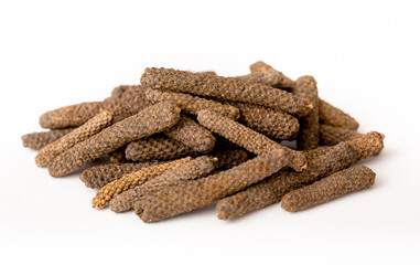 Pippali long pepper, spice close-up flat lay on a white background. Indian and Arabic spices for cooking. Medicinal herbs and spices.
