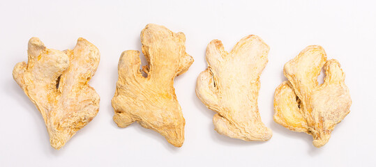 Dried ginger root on white background isolated. Indian spices close up.