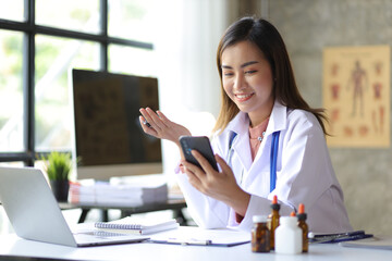 Female doctor working in the doctor's office at the hospital.