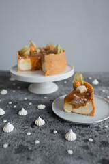 Sweet cheesecake with caramel on the table