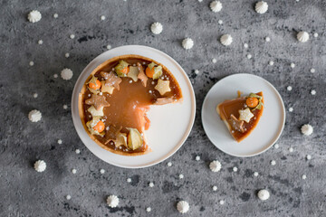 Sweet cheesecake with caramel on the table