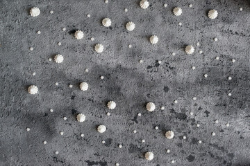 Small white marshmallows on a gray background