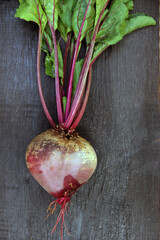 Fresh organic beets on a wooden background