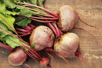 Fresh organic beets on a wooden background