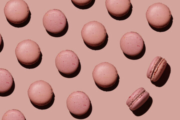 a lot of pink macaroons on a blue background