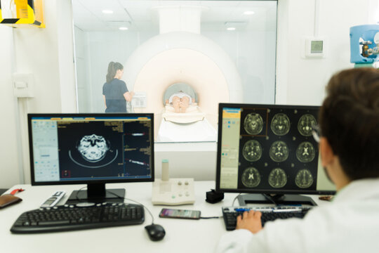 Radiologist checking the test results in the computer during an MRI
