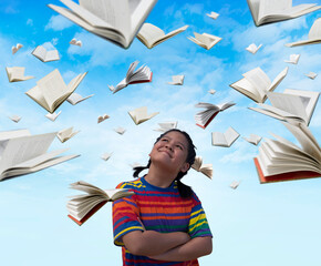 asian kid thinking with flying books
