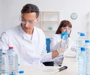 Two chemists working in the lab