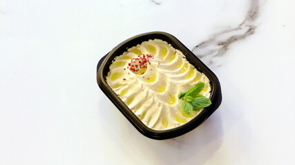 Delicious hummus with olive oil and mint